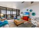 Bright living room with a cozy seating area and a sliding glass door to the balcony at 9525 Blind Pass Rd # 505, St Pete Beach, FL 33706