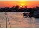 Waterfront view of docks and houses at sunset at 9525 Blind Pass Rd # 505, St Pete Beach, FL 33706