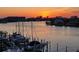 Waterfront view of boats docked near the residences at sunset at 9525 Blind Pass Rd # 505, St Pete Beach, FL 33706