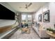 Cozy living room features stylish furniture, large windows, and contemporary decor at 9932 Surrey Rose Dr, San Antonio, FL 33576