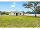Expansive backyard with a well-maintained lawn and a white fence surrounding the property at 10452 Elgin Blvd, Spring Hill, FL 34608