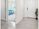 Inviting entryway featuring neutral tile flooring, with a view to a bedroom on the left at 10452 Elgin Blvd, Spring Hill, FL 34608