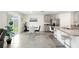 Bright kitchen features stainless steel appliances, granite counters, and an adjacent dining area with sliding door access to the backyard at 10452 Elgin Blvd, Spring Hill, FL 34608