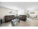 This living room is complete with neutral color palette, tile floors, and comfortable seating at 10452 Elgin Blvd, Spring Hill, FL 34608