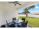 Covered patio featuring an outdoor dining table, perfect for relaxation and entertaining at 10452 Elgin Blvd, Spring Hill, FL 34608