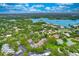 Beautiful aerial view showcasing a residential area with mature trees, bay views, and community amenities at 1111 N Bayshore Blvd # E10, Clearwater, FL 33759