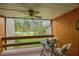 Relaxing balcony with seating overlooking lush green landscaping and trees at 1111 N Bayshore Blvd # E10, Clearwater, FL 33759