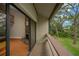 Balcony view of yard and fireplace, accessed through sliding glass doors at 1111 N Bayshore Blvd # E10, Clearwater, FL 33759
