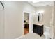Bright bathroom featuring a modern vanity and a doorway view into the bedroom at 1111 N Bayshore Blvd # E10, Clearwater, FL 33759