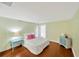 Inviting bedroom with hardwood floors, adorned with string lights and a light blue dresser at 1111 N Bayshore Blvd # E10, Clearwater, FL 33759