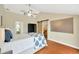 Bedroom suite with accent wall, fan, ensuite bathroom, and large closet with sliding barn door at 1111 N Bayshore Blvd # E10, Clearwater, FL 33759