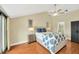 Inviting bedroom with tray ceiling, fan, ensuite bathroom and sliding glass doors at 1111 N Bayshore Blvd # E10, Clearwater, FL 33759