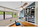 Bright dining area featuring a built-in bookcase and large windows at 1111 N Bayshore Blvd # E10, Clearwater, FL 33759