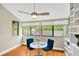 Bright dining area featuring a built-in bookcase and large windows at 1111 N Bayshore Blvd # E10, Clearwater, FL 33759
