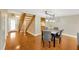 Hardwood floors in dining room area with view of the staircase and front door at 1111 N Bayshore Blvd # E10, Clearwater, FL 33759