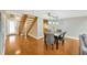 Open concept dining room with hardwood floors, staircase, and modern lighting at 1111 N Bayshore Blvd # E10, Clearwater, FL 33759