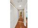 Bright hallway features hardwood floors and large closet with bi-fold doors at 1111 N Bayshore Blvd # E10, Clearwater, FL 33759