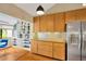 Bright kitchen featuring stainless steel appliances and warm wood cabinets at 1111 N Bayshore Blvd # E10, Clearwater, FL 33759