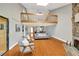 Spacious living room with hardwood floors, stone fireplace, and loft space at 1111 N Bayshore Blvd # E10, Clearwater, FL 33759