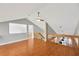 Open-concept room with beautiful hardwood floors and staircase that leads to upper level at 1111 N Bayshore Blvd # E10, Clearwater, FL 33759