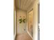 Covered front patio with tile flooring and wall decor providing a cozy entrance at 1111 N Bayshore Blvd # E10, Clearwater, FL 33759