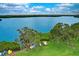 Picturesque waterfront property with kayak storage, lush trees, and serene blue waters at 1111 N Bayshore Blvd # E10, Clearwater, FL 33759