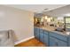 Charming wet bar boasts a countertop, storage cabinets, and mirror backsplash at 1111 N Bayshore Blvd # E10, Clearwater, FL 33759
