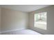Bright bedroom with neutral walls and natural light at 11483 Poorwill Ave, Brooksville, FL 34614