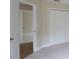 Cozy bedroom featuring neutral carpet, double door closet, and a view into the next room at 11483 Poorwill Ave, Brooksville, FL 34614