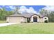 Charming single Gathering home with a 2-car garage and a well-manicured lawn at 11483 Poorwill Ave, Brooksville, FL 34614