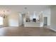 Open-concept living space with a modern kitchen and dining area, perfect for entertaining at 11483 Poorwill Ave, Brooksville, FL 34614