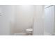 Bright powder room featuring a toilet and storage closet at 11483 Poorwill Ave, Brooksville, FL 34614