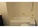 Bathroom showcasing a combination shower and tub with a toilet at 11511 113Th St # 4F, Seminole, FL 33778