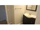 Bathroom featuring a vanity with a white sink, a dark cabinet, and a mirror above at 11511 113Th St # 4F, Seminole, FL 33778