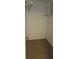 A small closet includes wire shelving, tiled floors, and a door on the right at 11511 113Th St # 4F, Seminole, FL 33778