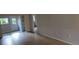 Spacious living room with tiled flooring and bright windows overlooking exterior at 11511 113Th St # 4F, Seminole, FL 33778