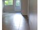 Living room showing tile floors, neutral walls and views to the outside at 11511 113Th St # 4F, Seminole, FL 33778