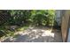 Back patio area featuring tropical landscaping creating privacy and a relaxing outdoor space at 11511 113Th St # 4F, Seminole, FL 33778