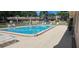 Sparkling community pool with ample seating provides a refreshing escape and social area for residents at 11511 113Th St # 4F, Seminole, FL 33778