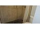 The bathroom features a tiled shower with a dark floor, a shower curtain, and a toilet nearby at 11511 113Th St # 4F, Seminole, FL 33778