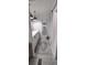 Stylish bathroom featuring white cabinets, marble countertop, and modern vanity lighting at 123 S Dolphin Dr, Oldsmar, FL 34677