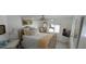 Inviting bedroom featuring white furniture, neutral tones, and bright windows at 123 S Dolphin Dr, Oldsmar, FL 34677