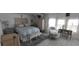Serene bedroom features bright windows, white furniture, and a comfortable bed at 123 S Dolphin Dr, Oldsmar, FL 34677