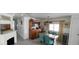 Cozy dining room boasts natural light, a wooden table with seating for four, and vintage china cabinet at 123 S Dolphin Dr, Oldsmar, FL 34677