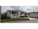 Charming single-story home with well-maintained lawn and covered porch at 123 S Dolphin Dr, Oldsmar, FL 34677