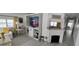 Inviting living room with a fireplace, custom shelving, and bright, sunny windows at 123 S Dolphin Dr, Oldsmar, FL 34677