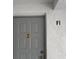 Condo unit with a neutral color front door at 1258 Pine Ridge W Cir # F1, Tarpon Springs, FL 34688