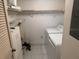 Functional laundry room with washer, dryer, shelving, and storage cabinets for convenience at 1258 Pine Ridge W Cir # F1, Tarpon Springs, FL 34688