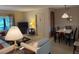 Spacious living room with dining area and lots of natural light at 1258 Pine Ridge W Cir # F1, Tarpon Springs, FL 34688