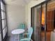 Screened patio with table and chairs at 1258 Pine Ridge W Cir # F1, Tarpon Springs, FL 34688